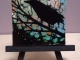 Crow II painting on easel